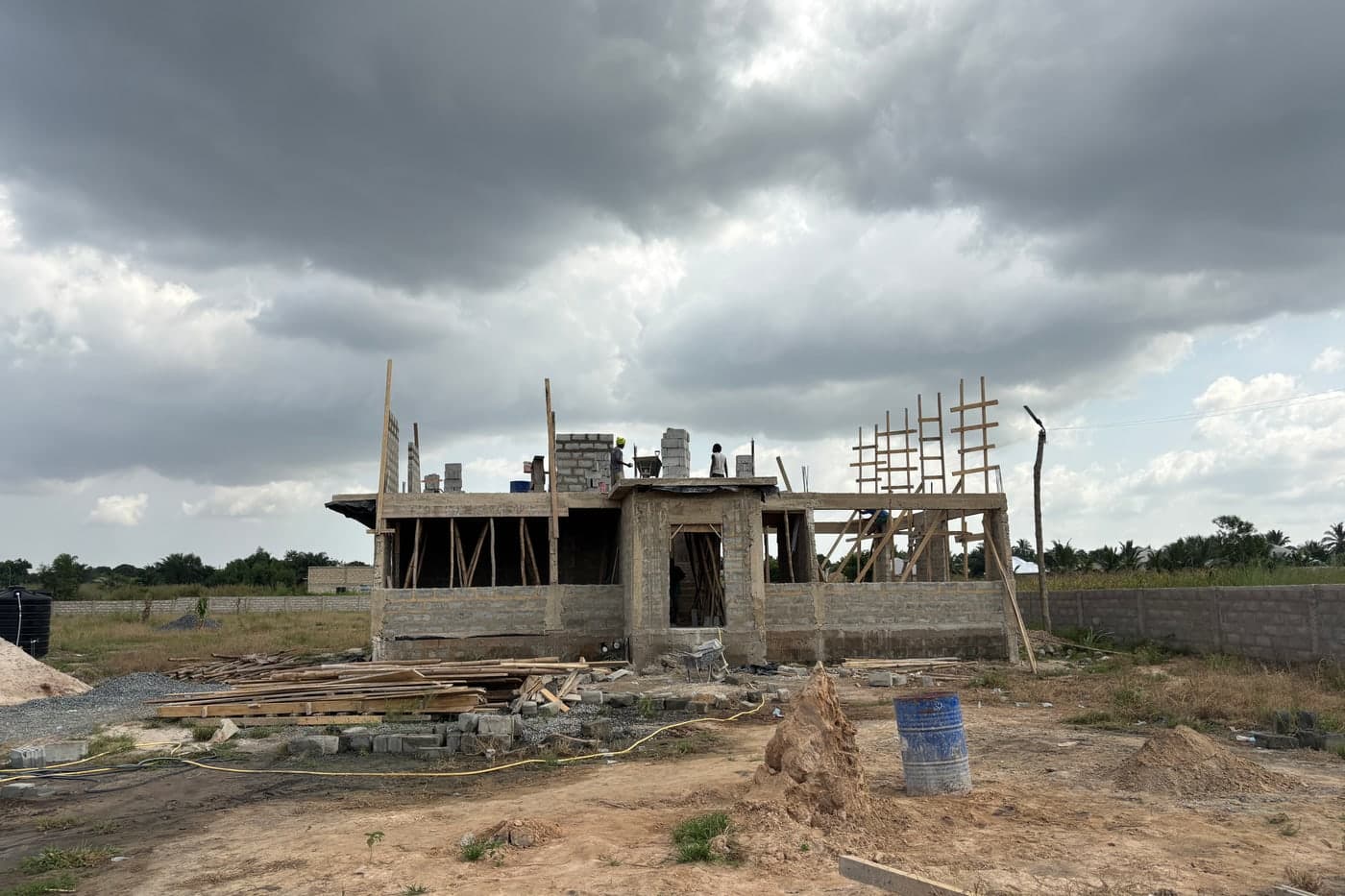 Cement, blocks and reinforcement delivered to a building site in the Volta Region